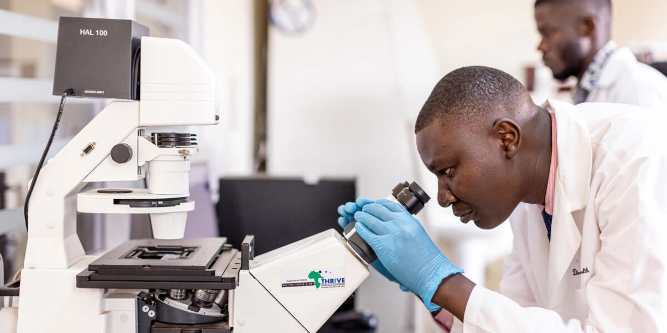 Scientist with microscope